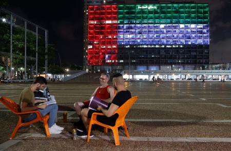 The city hall in the Israeli coastal city of Tel Aviv is lit up in the colours of the United Arab Emirates national flag on August 13, 2020. Israel and the UAE agreed to normalise relations in a landmark US-brokered deal, only the third such accord the Jewish state has struck with an Arab nation. (AFP)