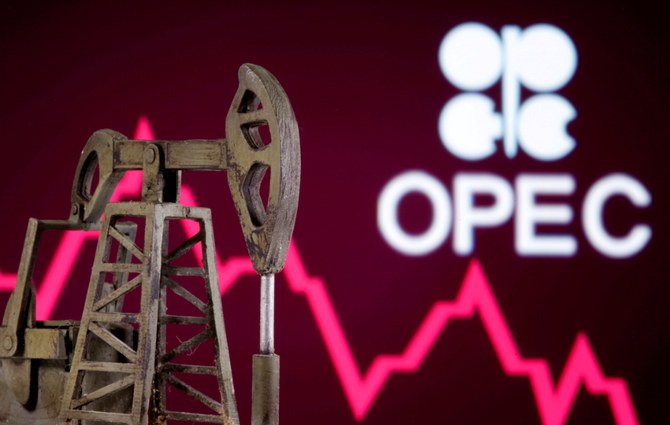 A 3D printed oil pump jack is seen in front of displayed stock graph and OPEC logo in this illustration picture. (REUTERS/Dado Ruvic/File Photo)