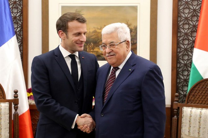 Macron told Abbas he was determined to work on the peace process. (AFP/File)