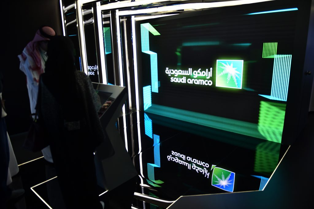 Visitors stop at the Aramco exhibition section at the Misk Global Forum on innovation and technology held in the Saudi capital Riyadh on November 13, 2019. - The Misk non-profit foundation was established by Saudi Arabia's powerful crown prince, Mohammed bin Salman to empower Saudi youths through cultivating learning and leadership. (AFP)
