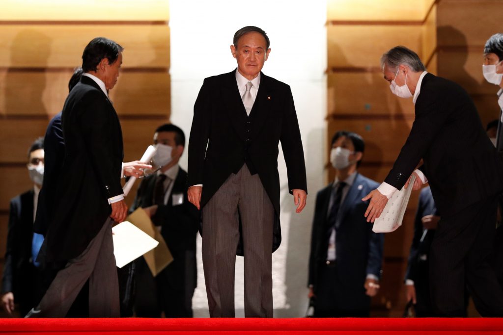 Japan's new Prime Minister Yoshihide Suga (C) leads his cabinet ministers for a photo session at prime minister's official residence in Tokyo on Sep. 16, 2020. (AFP)