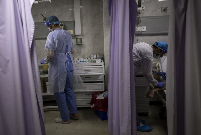 Experts have warned that a wider coronavirus outbreak in Gaza, home to some 2 million Palestinians, could be catastrophic because of the fragile health sector. (AP)