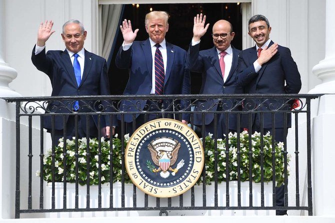 Israeli Prime Minister Benjamin Netanyahu, Donald Trump, Bahrain foreign minister Abdullatif bin Rashid Al-Zayani, and UAE foreign minister Abdullah bin Zayed wave from the Truman Balcony at the White House after they signed the Abraham Accord. (AFP)