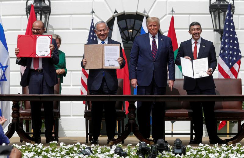 Bahrain’s FM Abdullatif Al Zayani, Benjamin Netanyahu and UAE FM Abdullah bin Zayed with Donald Trump at the signing of the Abraham Accords. (Reuters)