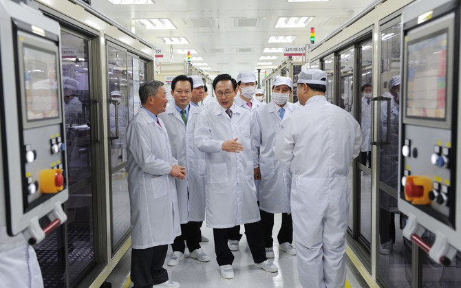 Officials tour around LG Chem’s car battery plant in the town of Ochang in Cheongwon county, about 100 km south of Seoul. (AFP)