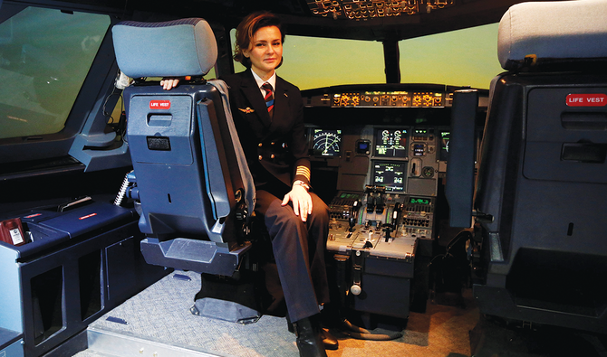 A pilot poses for a photograph in the A320 flight simulator at the Aeroflot training center at Sheremetyevo Airport outside Moscow. (Reuters/File)