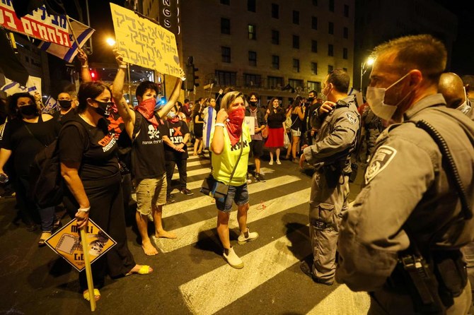 Israeli protesters gather during a demonstration amid a second lockdown in front of Prime Minister Benjamin Netanyahu’s residence in Jerusalem, on September 26, 2020. (AFP)