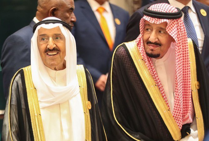 In this file photo taken on June 01, 2019 Saudi Arabia's King Salman bin Abdulaziz (R) stands next to Kuwait's Emir Sheikh Sabah al-Ahmad al-Sabah in the Saudi holy city of Mecca. Kuwait's emir Sheikh Sabah al-Ahmad Al-Sabah, the architect of the nation's modern foreign policy and mediator in some of the worst crises to grip the Gulf, died on Tuesday at the age of 91, according to the royal court. (AFP)