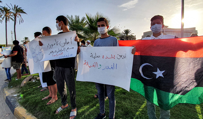 Libyans demonstrate against the presence of armed militias in the city of Tajoura, southeast of the capital Tripoli on September 28, 2020. (AFP)