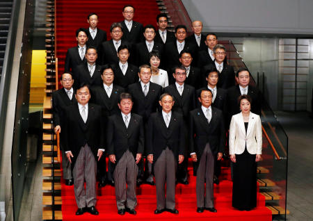 Japan's Prime Minister Yoshihide Suga (front C) attends a photo session with his cabinet ministers at Suga's official residence in Tokyo, Japan, September 16, 2020. (Reuters)