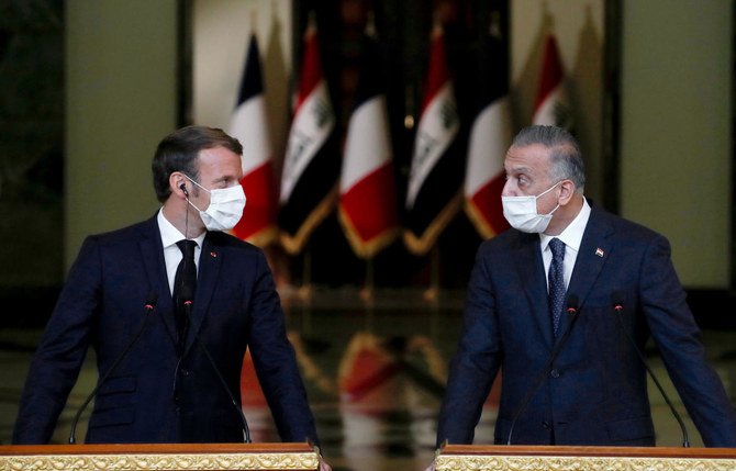 Emmanuel Macron and Iraq's Prime Minister Mustafa Al-Kadhimi discussed energy cooperation during the French president's visit to Baghdad. (AFP)