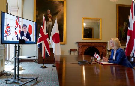 In this file photo taken on June 09, 2020 a handout image released by 10 Downing Street, shows Britain's International Trade Secretary Liz Truss (right) during a video conference call with Japan's Foreign Minister Toshimitsu Motegi, as they formally begin negotiations on a free trade agreement, at the Department for International Trade in London on June 9, 2020. (AFP)