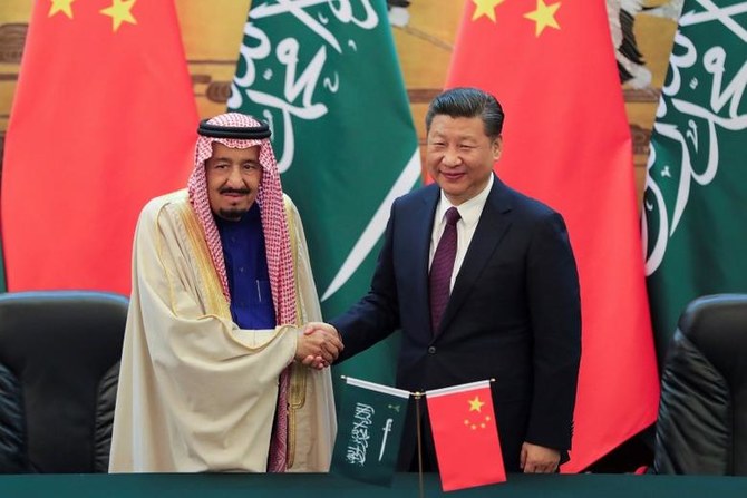 Saudi Arabia’s King Salman (left) and China’s President Xi Jinping shake hands during a signing ceremony at the Great Hall of the People in Beijing, China. (File/Reuters)