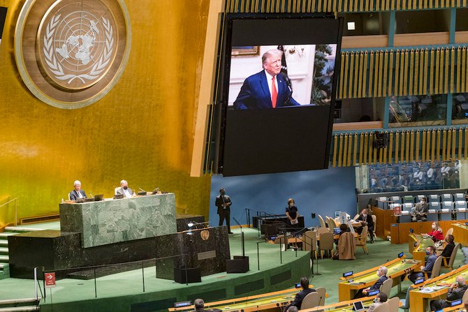 Donald Trump is on video screens as his pre-recorded message is played during the 75th session of the United Nations General Assembly. (UN Photo/via AP)