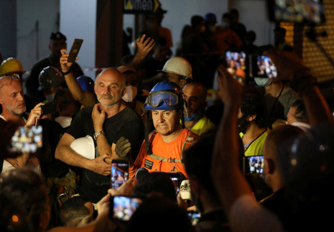 Francisco Lermanda, a member of the Chilean team talks during a press conference after digging through the rubble of buildings which collapsed by the explosion at the city's port area, after signs of life were detected, in Gemmayze, Beirut, Lebanon on Sept. 5, 2020. (REUTERS/Mohamed Azakir)