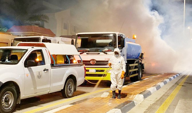 Eastern Province municipality workers clean streets in Dammam as part of steps to check the spread of the coronavirus. (SPA)