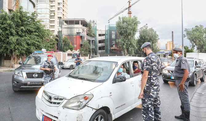 Security forces man a checkpoint in Beirut as part of restrictions to combat COVID-19. Lebanon’s total number of cases has exceeded 20,000. (File/AFP)