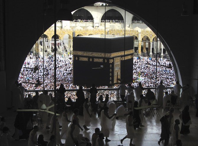In this May 25, 2019 file photo, Muslim worshippers circumambulate the Kaaba, the cubic building at the Grand Mosque, during the minor pilgrimage, known as Umrah in the Muslim holy city of Makkah, Saudi Arabia. (AP)