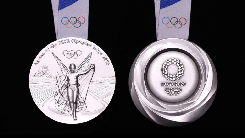 The silver medal for the Tokyo 2020 Olympic Games, which were unveiled during a ceremony marking one year before the start of the games in Tokyo, July. 24, 2019. (AFP)