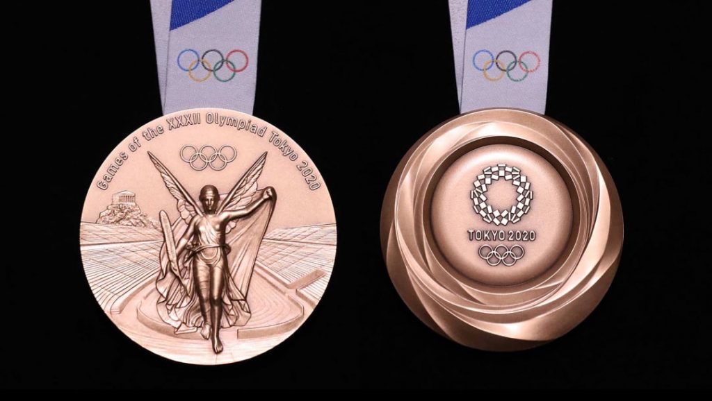 The gold medal for the Tokyo 2020 Olympic Games, which were unveiled during a ceremony marking one year before the start of the games in Tokyo, July. 24, 2019. (AFP)