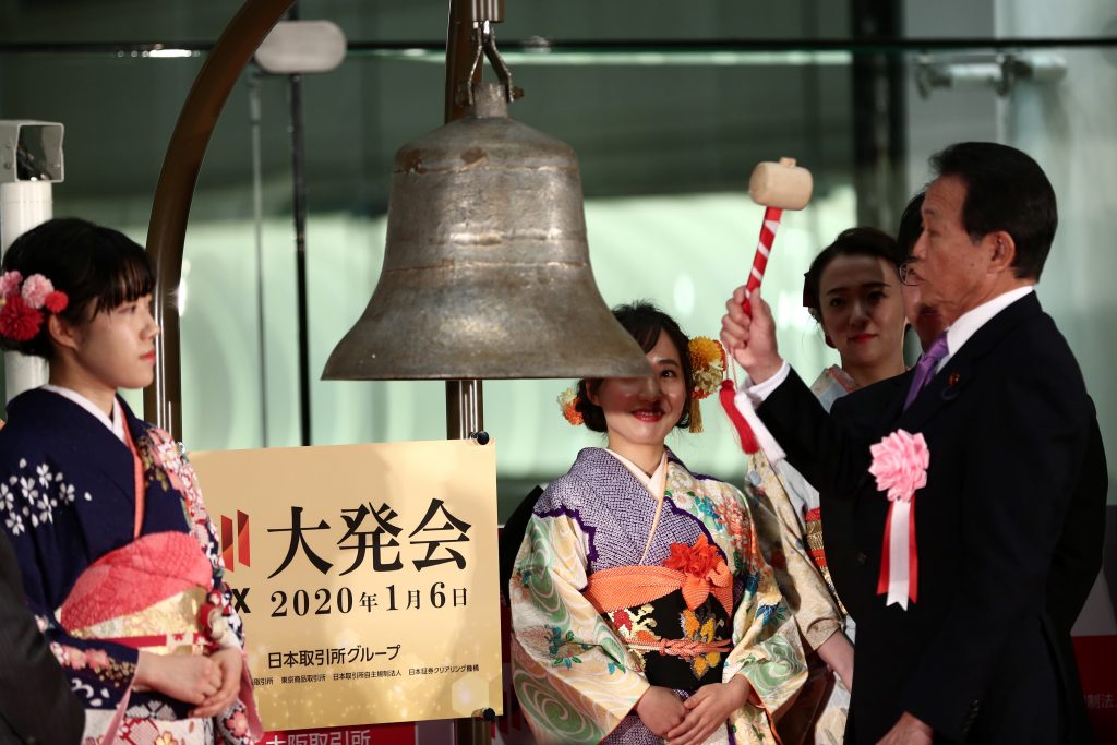 Japanese Finance Minister Taro Aso rings a bell to start the new year’s trading during a ceremony at the Tokyo Stock Exchange in Tokyo, Jan. 6, 2020. (AFP)