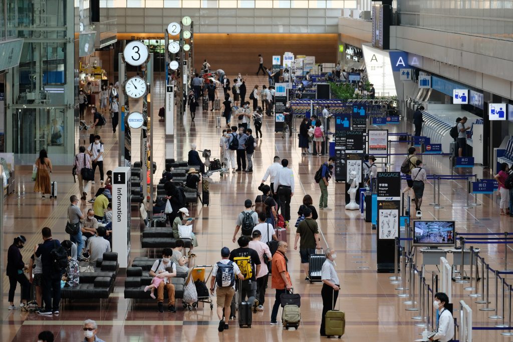 A view of the domestic departure lobby of Tokyo's Haneda airport, July 25, 2020. (AFP)