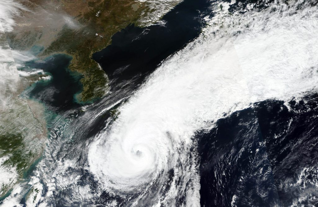 Satellite image released by NASA Worldview, Earth Observing System Data and Information System (EOSDIS) shows the clouds cover over Japan as Typhoon Chan-hom advancing northward over waters south of Japan, Oct. 8, 2020. (NASA via AP)