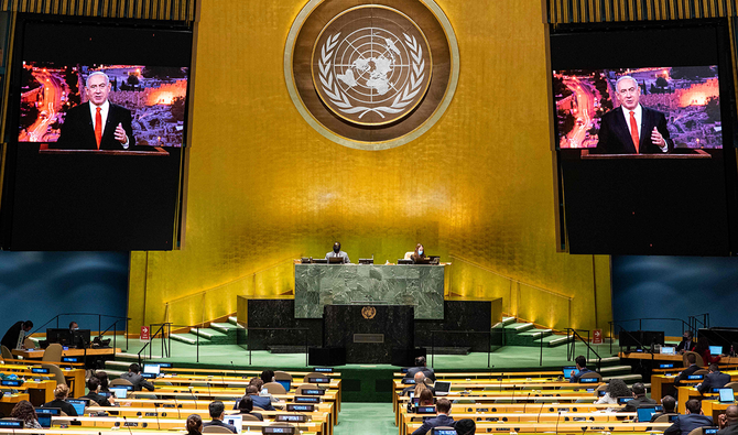 This UN handout photo shows Benjamin Netanyahu (on screens), Prime Minister of Israel, as he virtually addresses the general debate of the 75th session of the United Nations General Assembly, on September 29, 2020, in New York. (AFP)