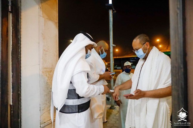 The first group of pilgrims are checked for signs of coronavirus as they arrive in Jeddah on Saturday, before proceeding to Makkah. (Supplied)