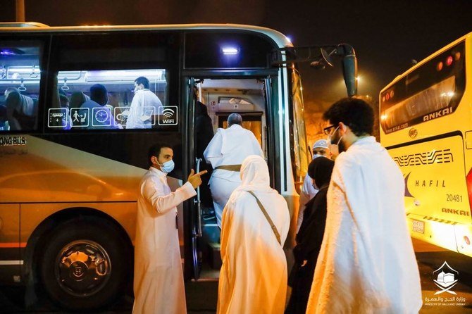 Pilgrims board a bus at the airport in Jeddah on Saturday, on their way to Makkah. (Supplied)