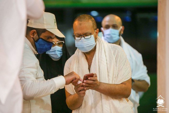 The first group of pilgrims are checked for signs of coronavirus as they arrive in Jeddah on Saturday, before proceeding to Makkah. (Supplied)