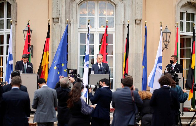 German Foreign Minister Heiko Maas (C), UAE Foreign Minister Abdullah bin Zayed (L), and Israeli Foreign Minister Gabi Ashkenazi (R), speak at a press conference after their meeting in front of Villa Borsig, Tuesday, Oct. 6, 2020, in Berlin, Germany. The three foreign minister met for talks in the German capital. (AP)