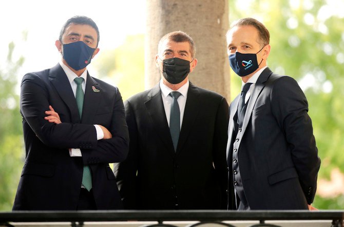 German Foreign Minister Heiko Maas (R), stands with UAE Foreign Minister Abdullah bin Zayed (L), and Israeli Foreign Minister Gabi Ashkenazi (C), as they arrive for talks at the German foreign ministry’s guesthouse Villa Borsig Tuesday, Oct. 6, 2020, in Berlin, Germany. (AP)