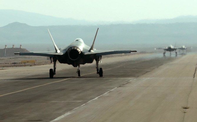 Israeli F-35 fighter jets roll on the tarmac during the 