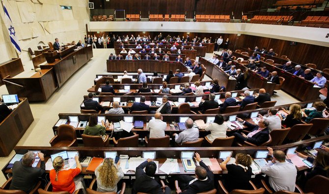 Israeli members of parliament attend the Knesset Plenary Hall session ahead of the vote on the National Law which speaks of Israel as the historic homeland of the Jews and says they have a 