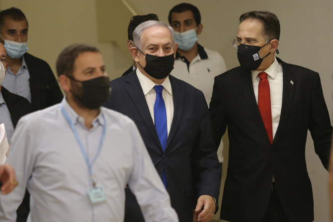 Israeli Prime Minister Benjamin Netanyahu, center, arrives at the Israeli Knesset, or Parliament in Jerusalem ahead of the discussion of the peace treaty with the UAE, Thursday, Oct. 15, 2020. (AP)