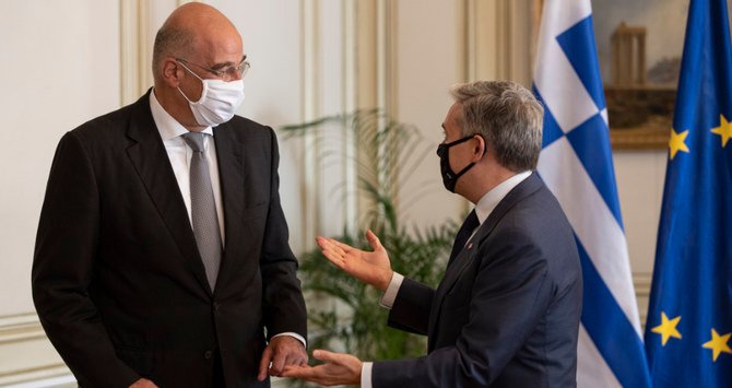 Greece says the plane carrying Greek Foreign Minister Nikos Dendias, left, had been deliberately held up. (AP)