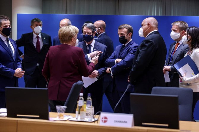 Bulgaria's Prime Minister Boyko Borisov, French President Emmanuel Macron, Cypriot President Nicos Anastasiades and Germany's Chancellor Angela Merkel, wearing face masks, speak with each other on the second day of an EU summit, in Brussels, Belgium October 16, 2020. (Reuters)