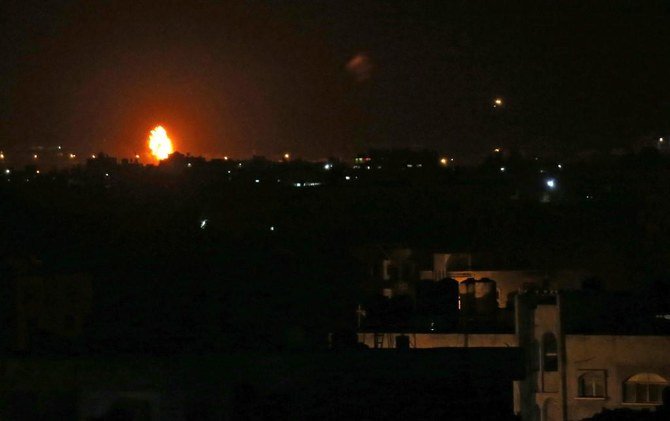 Flames are seen following an Israeli air strike in the town of Khan Yunis, in the southern Gaza Strip, early on October 23, 2020. (AFP)