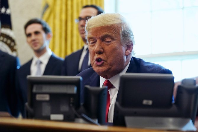 President Donald Trump speaks while on a phone call with leaders of Sudan and Israel in the Oval Office of the White House, Friday, Oct. 23, 2020, in Washington. (AP)