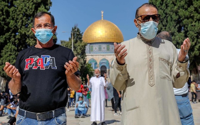 Palestinian Muslim worshippers attend Friday prayers at the Al-Aqsa mosque compound in the old city of Jerusalem on October 23, 2020 after it fully reopened following the latest lockdown in Israel since its first Covid-19 case in February. (AFP)