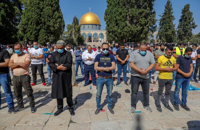 Palestinian Muslim worshippers attend Friday prayers at the Al-Aqsa mosque compound in the old city of Jerusalem on October 23, 2020 after it fully reopened following the latest lockdown in Israel since its first Covid-19 case in February. (AFP)