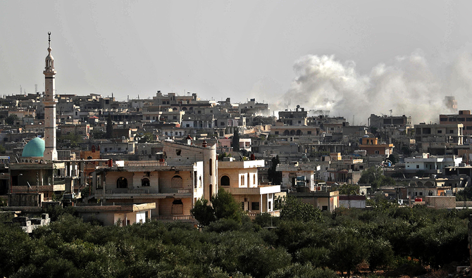 Smoke rises from the bombardment by the Syrian regime forces on Al-Bara, in the rebel-held northwestern province of Idlib. The region is the focus of a growing dispute between Turkey and Russia. (AFP)