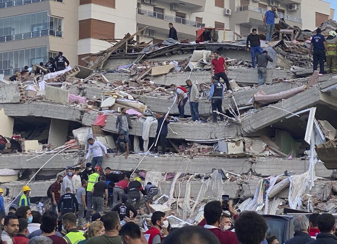 A strong earthquake struck Friday in the Aegean Sea between the Turkish coast and the Greek island of Samos, collapsing buildings in the city of Izmir in western Turkey, and officials said at least six people were killed and scores were injured.(AP/Ismail Gokmen)