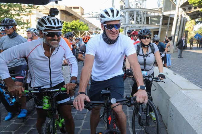 US former professional cyclist Lance Armstrong along with Lebanese sportsman Maxime Chaya prepare to lead 