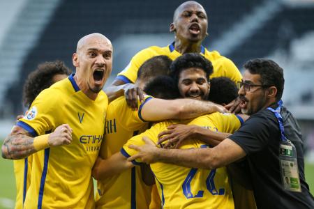 Saudi Arabia’s Al Nassr celebrate their opening goal against Al Ahli during the AFC Champions League quarter-final match at the Jassim Bin Hamad Stadium in the Qatari capital Doha on Wednesday. (AFP)