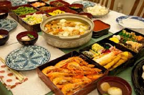 Stackable boxes filled with different kinds of dishes.