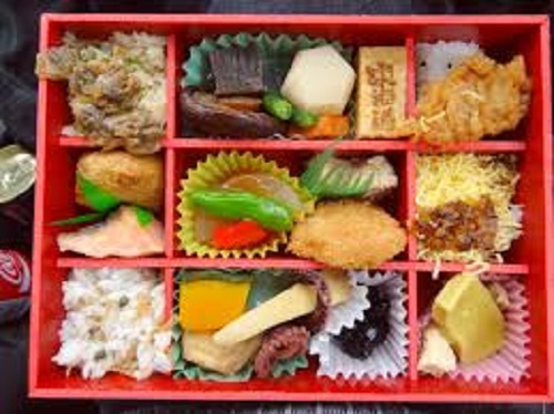 Stackable boxes filled with different kinds of dishes.