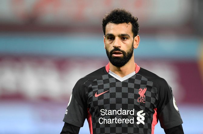Liverpool's Mohamed Salah has been hailed a “real life hero” after saving a homeless man from abuse and gifting him £100 ($129). (Pool via Reuters)