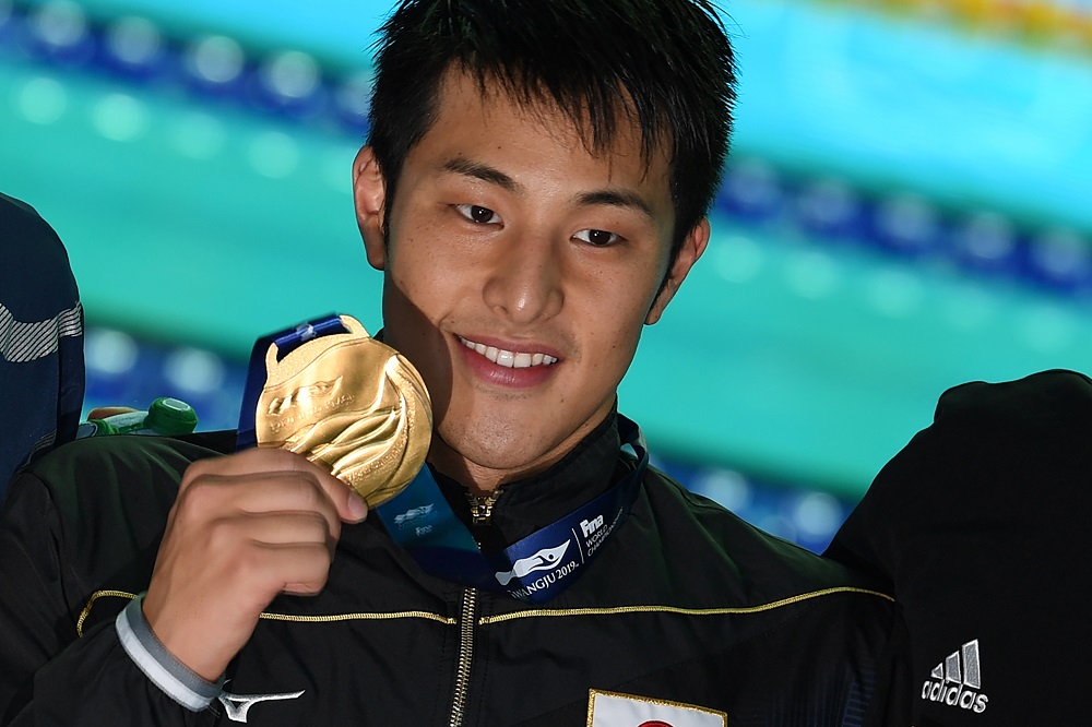 Gold medallist Japan's Daiya Seto celebrates during the medals ceremony after the final of the men's 400m individual medley event during the swimming competition at the 2019 World Championships at Nambu University Municipal Aquatics Center in Gwangju, South Korea, on July 28, 2019. (AFP)